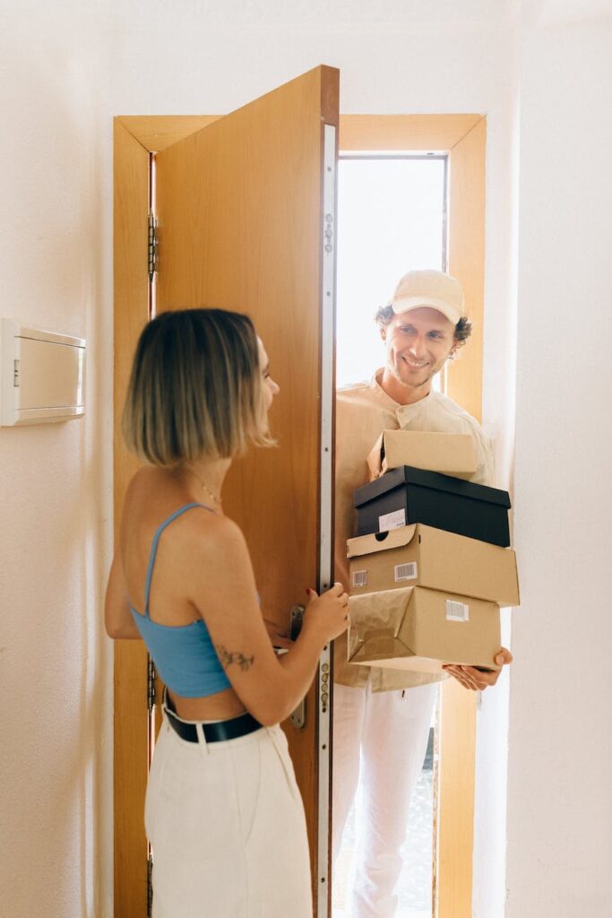 woman opening a door